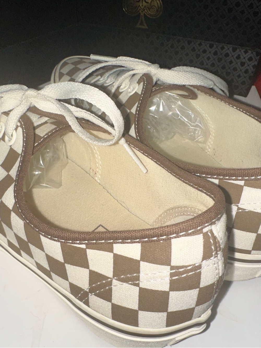 VAN’s Classic checkerboard tan and crème slip-ons. Sized Men’s 8.5 Women’s 10.0
